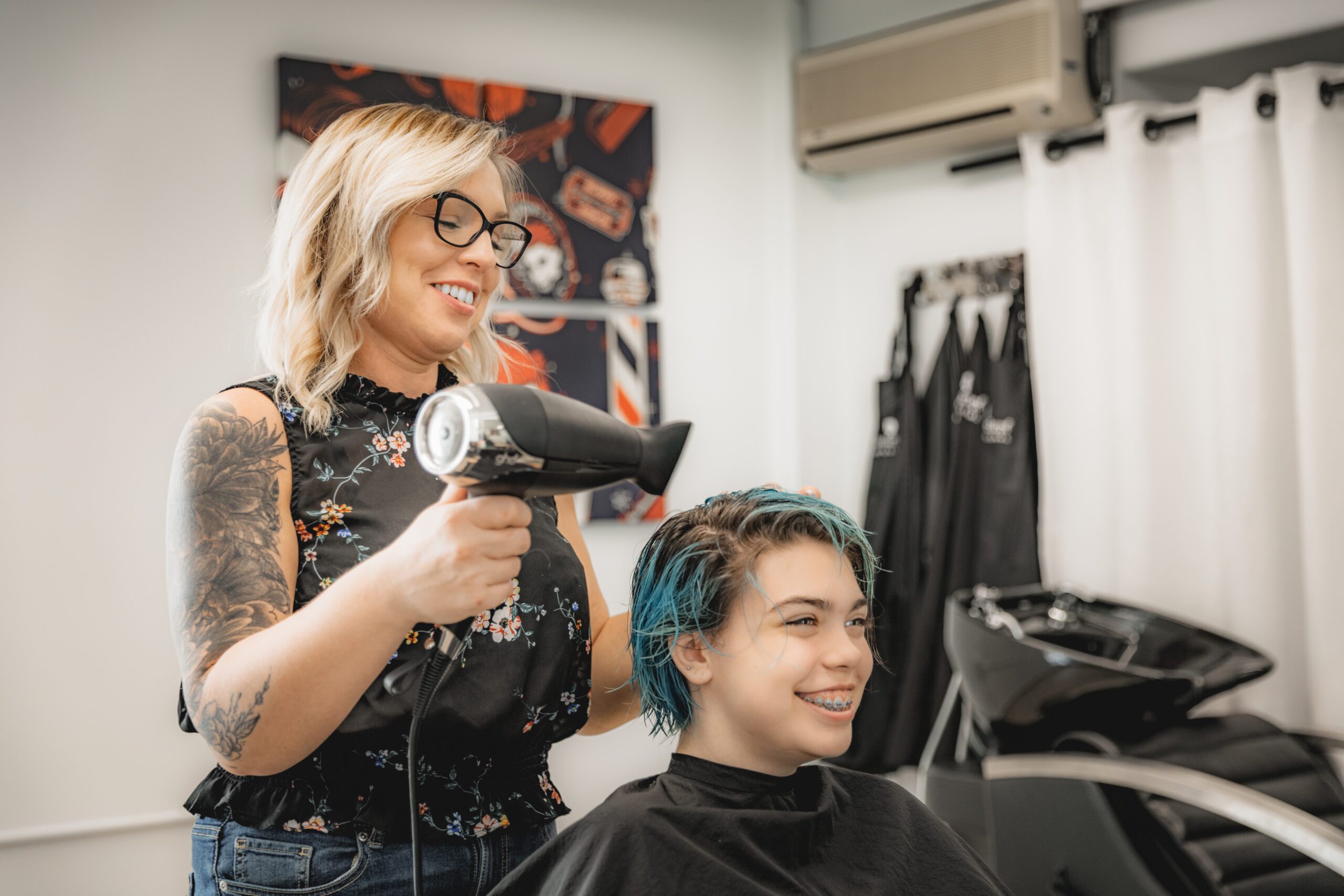 Hairstylist-blow-drying-clients-hair-scaled-1